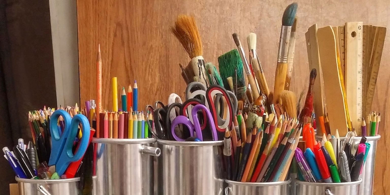 colorful art supplies in metal containers